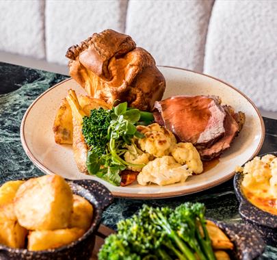 Sunday Roast with a sides of cauliflower cheese and vegetables