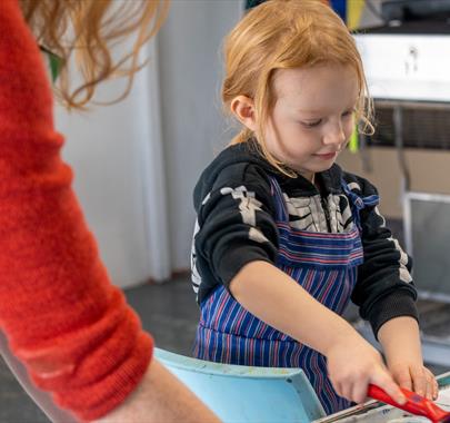Photo of a child crafting in a classroom