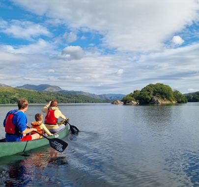 Visitors on a Guided Canoe Trip with Path to Adventure in Coniston, Lake District