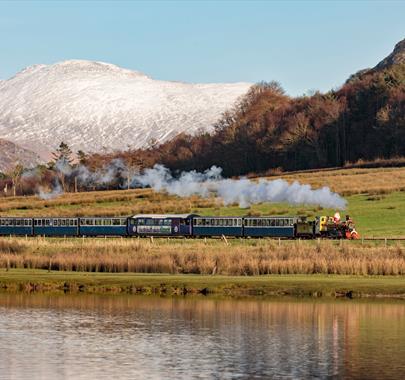 Snowy mountain behind the Ravenglass and Eskdale Railway.