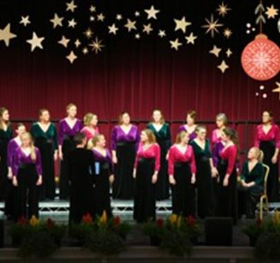 A choir on stage all looking in different directions