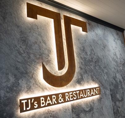 Signage at TJ's Bar and Restaurant at Park Foot Holiday Park in Pooley Bridge, Lake District