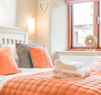 Double Bedroom and Folded Towels in The Byre at The Yan in Grasmere, Lake District