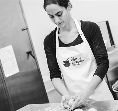 Black and White Photo of a Baker at The Coffee Kitchen Bakery in Cockermouth, Cumbria