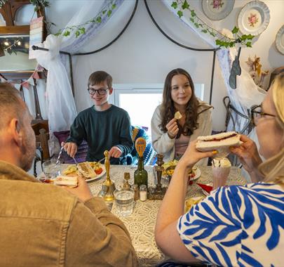 Family enjoying food and drink at The Fairydust Emporium in Silloth, Cumbria