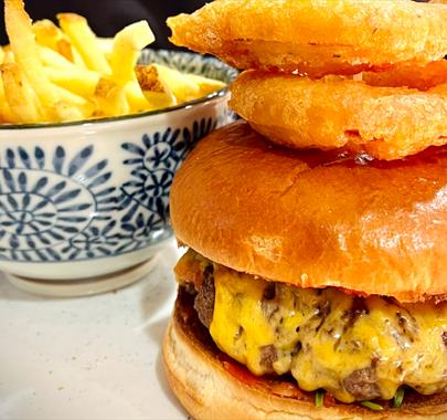 Burger with chips and onion rings from The Last Zebra in Carlisle, Cumbria