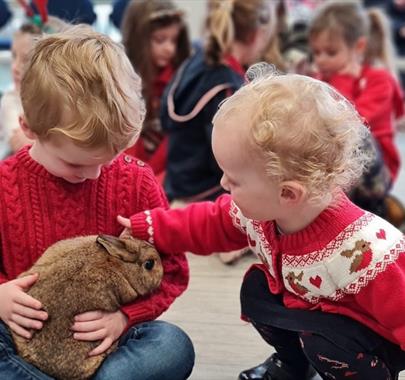 Children at the Christmas Pet Encounters Event at The Beacon Museum in Whitehaven, Cumbria