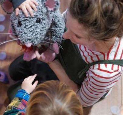 Big Days for Tiny Theatre Makers: Playtime, Theatre  a  lady carrying out a workshop with children showing a rat puppet
