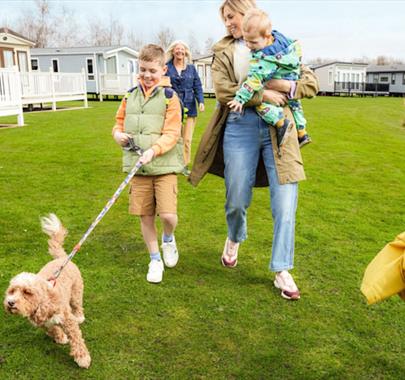 Family with dog at Lakeland Leisure Park in Flookburgh, Cumbria