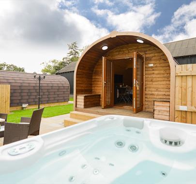 Exterior of Wellington Farm Glamping Pod, with Outdoor Seating and Hot Tub, in Cockermouth, Cumbria