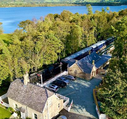 Aerial Photo of Bassenthwaite Lake Station & Carriage Cafe, with Bassenthwaite Lake in the Background, in the Lake District, Cumbria