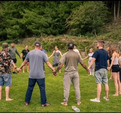 Group of people holding hands in a circle