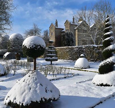 Snow topped topiary at Levens Hall near Kendal, Cumbria