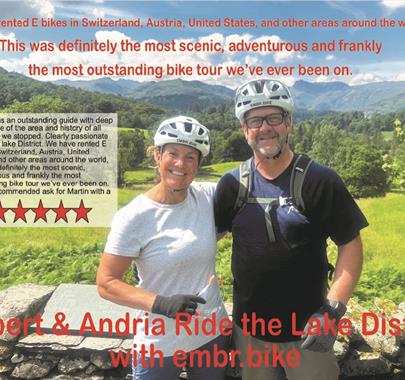 Couple on a guided cycle tour with EMBR Adventures in the Lake District, Cumbria, with a review written on the image