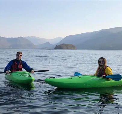 Visitors in kayaks from Newlands Adventure Centre in the Lake District, Cumbria
