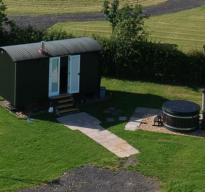 Exterior and Hot Tub at Reiver's Retreat at Low Moor Head Farm in Longtown, Cumbria