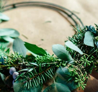 A Christmas wreath being made