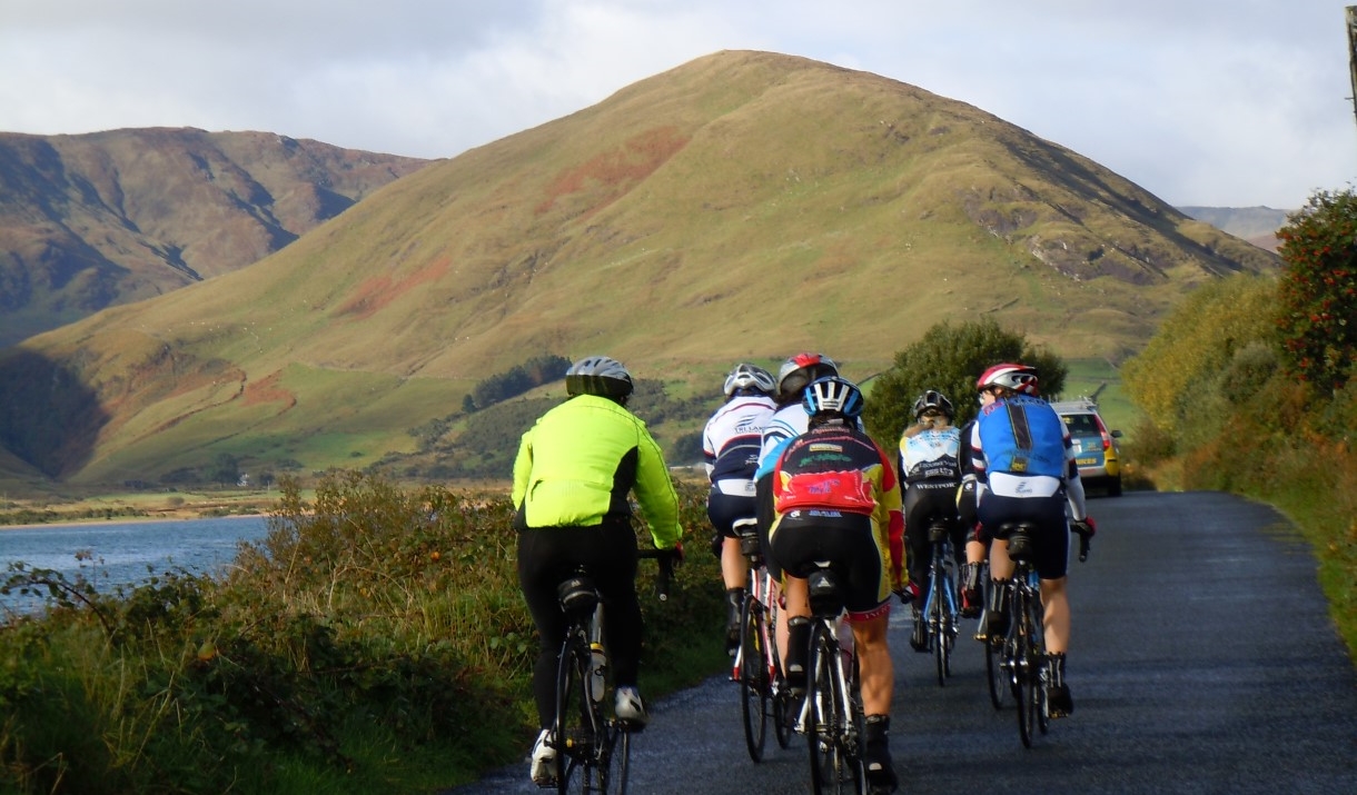 Cyclists with backdrop of fells