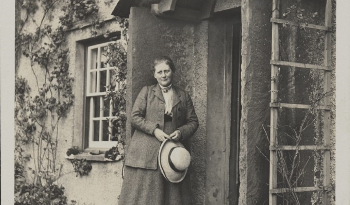 A photography of Beatrix Potter at her poarch at Hill Top