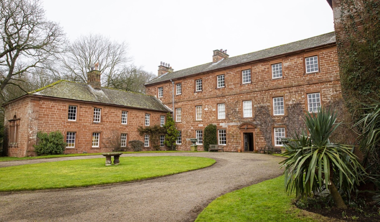 An image of Acorn Bank's driveway and front entrance