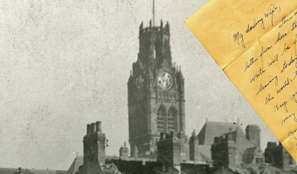 Black and white photo of a Church with a hand written letter sitting on on top of said photo