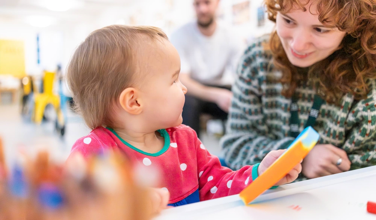 A baby and a women playing together