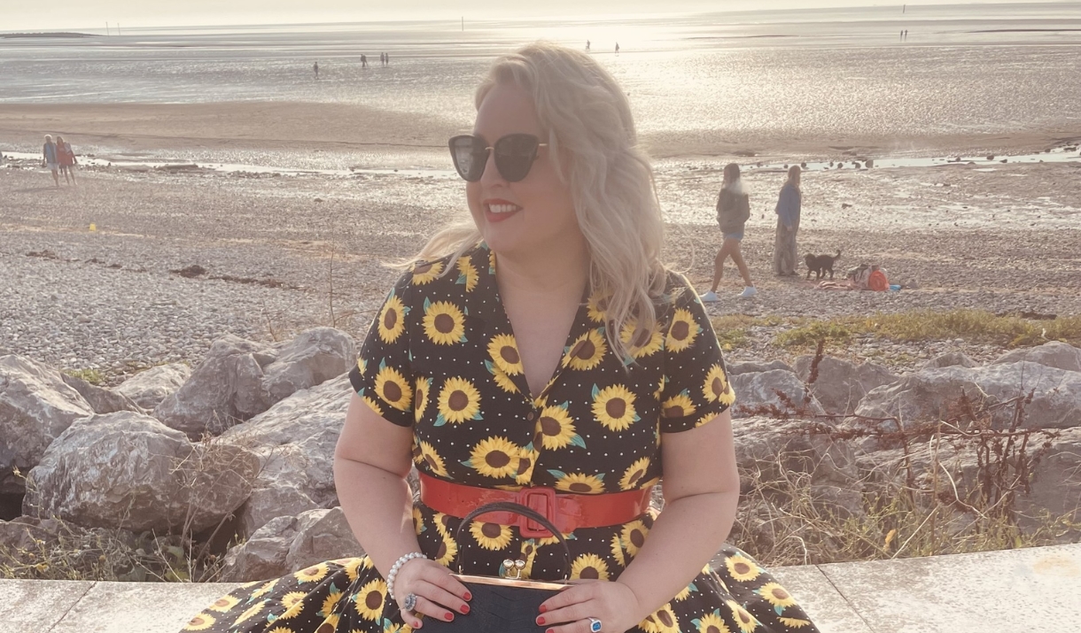 person wearing dress in front of beach