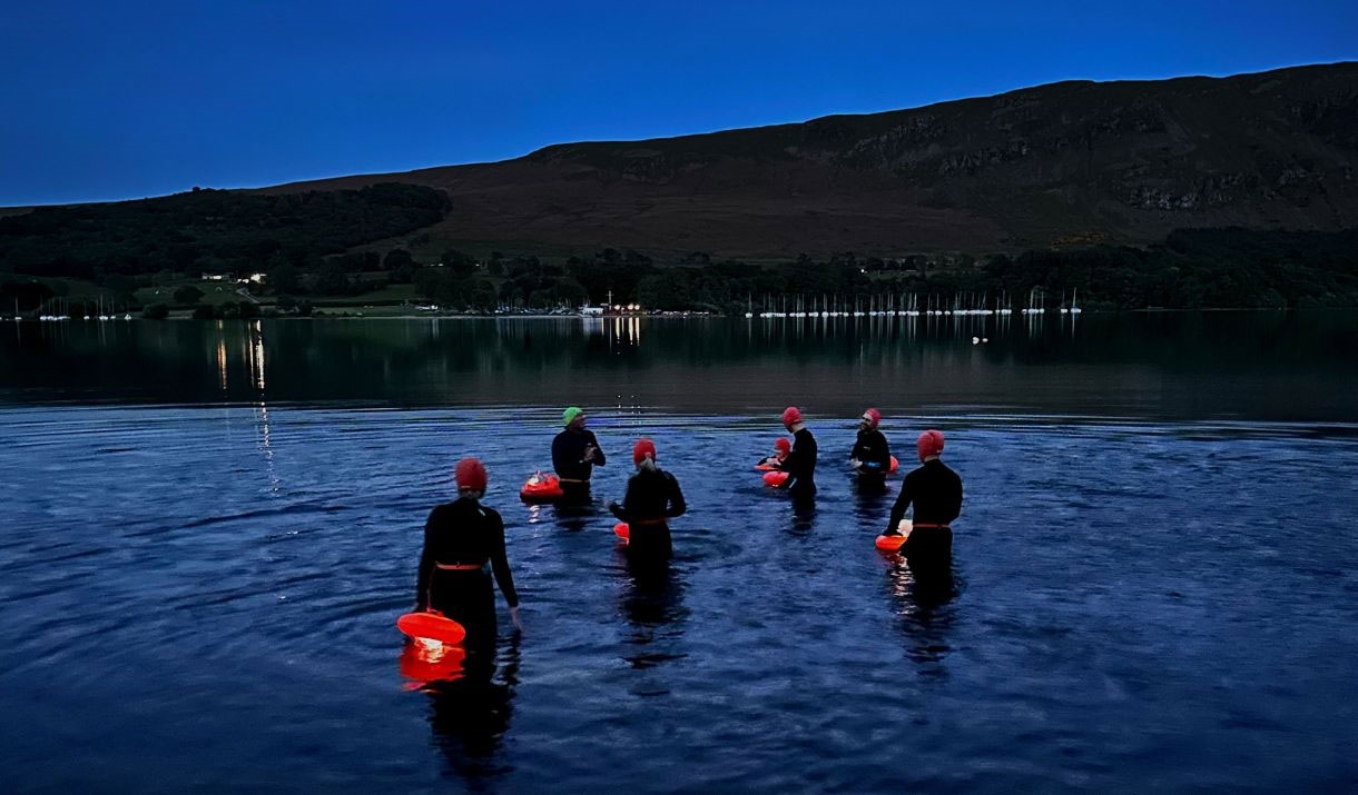 Visitors Enjoying the Stargazing Night Swim at Another Place, The Lake in Ullswater, Lake District