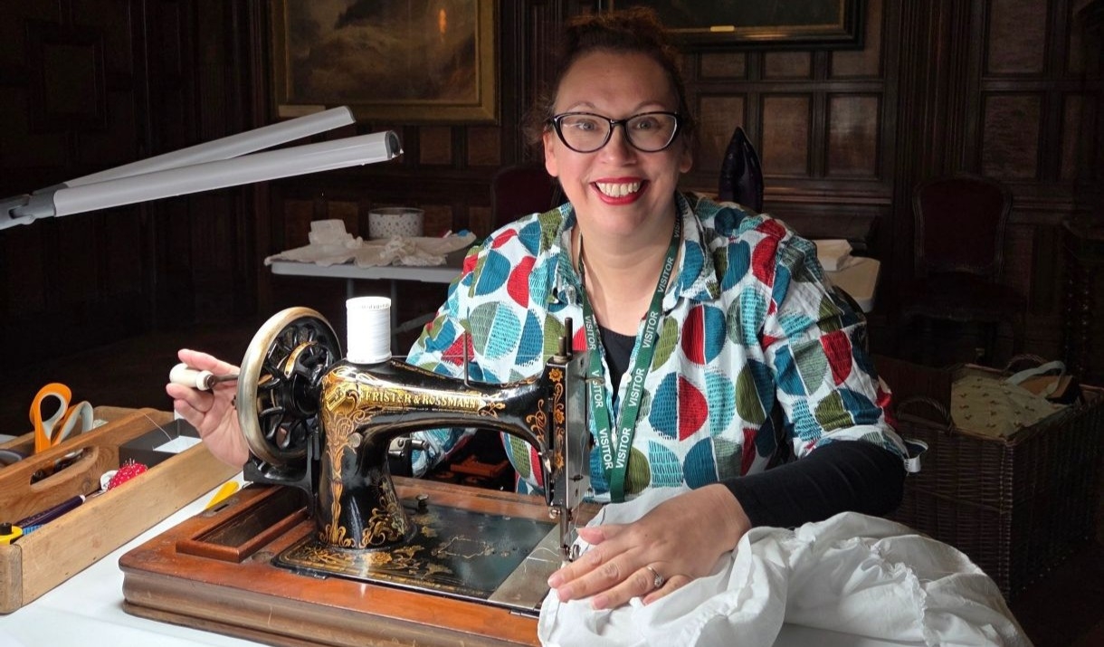 Becks Skinner sewing on a vintage sewing machine at Muncaster Castle.