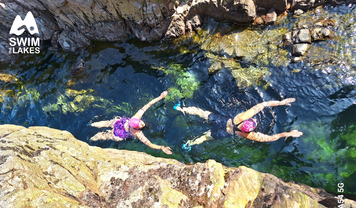 Swimmers enjoying a wild swim with Swim the Lakes