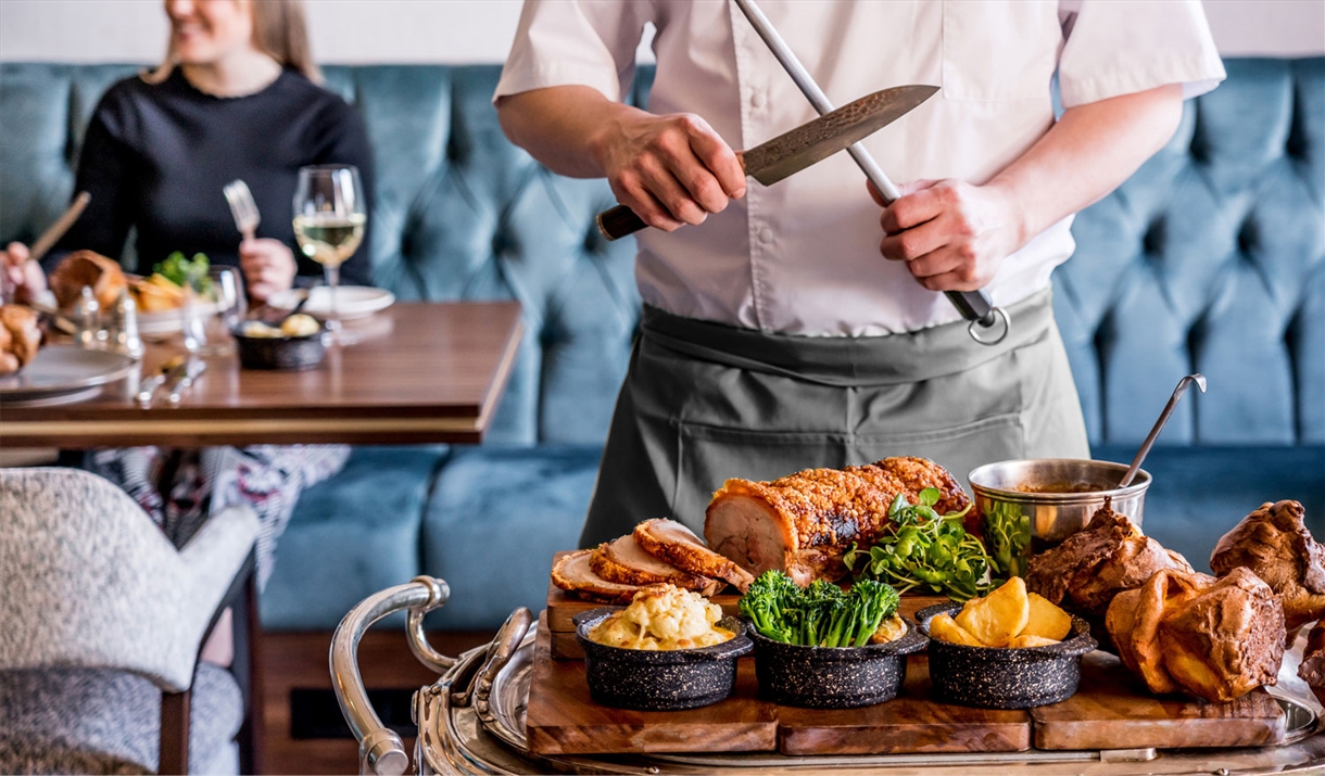 Chef Carving in the Restaurant at The Borrowdale Hotel in Borrowdale, Lake District