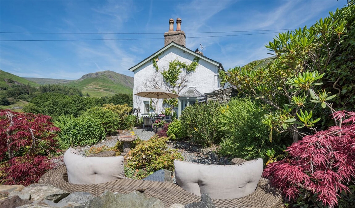 Outdoor seating and garden at Broadrayne Farm Cottages in Grasmere, Lake District