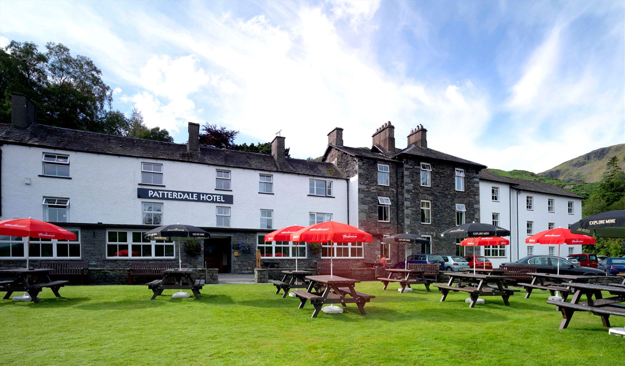 Exterior and picnic tables at The Patterdale Hotel in Ullswater, Lake District