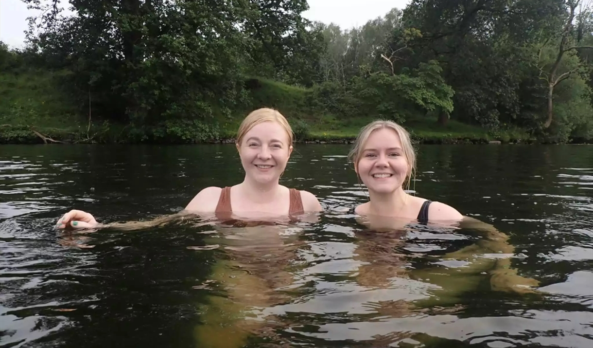 swimming in a dark lake