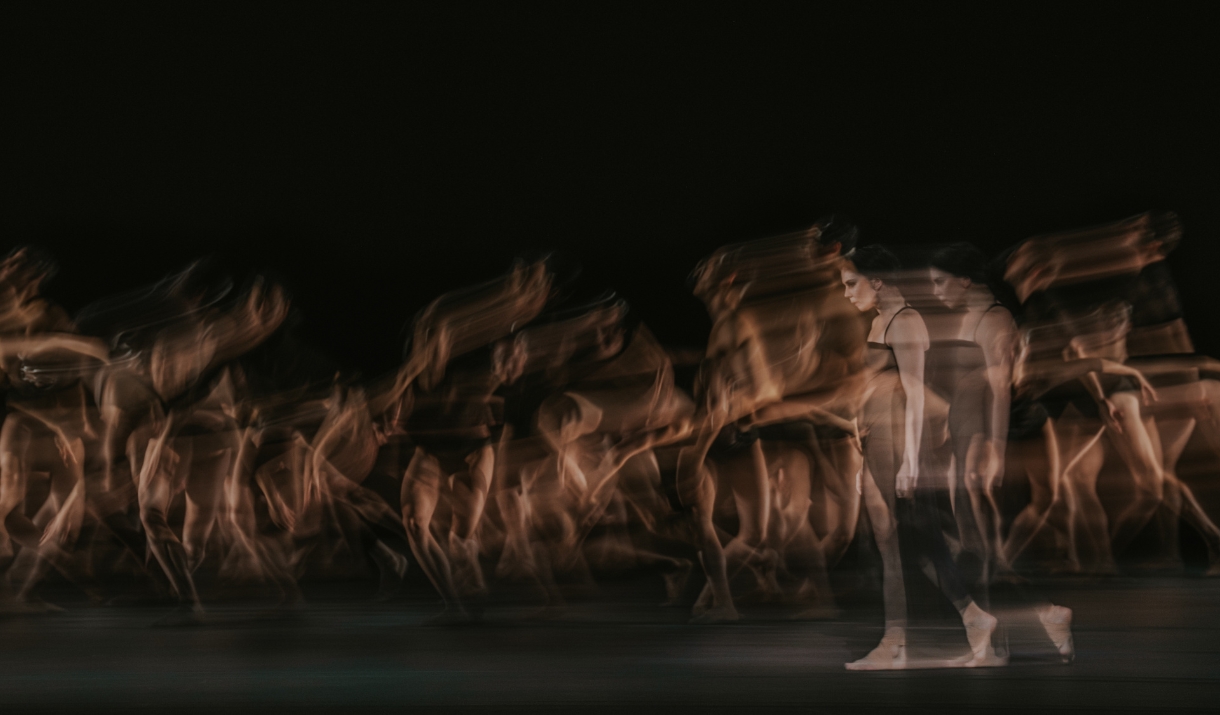 Long exposure photo of a women in a black dress