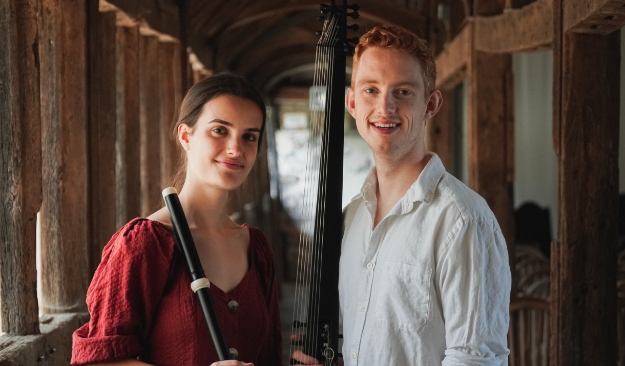 Flutes & Frets stood in archways with their instruments