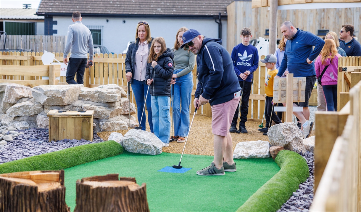 Family Playing at Foxy's Adventure Golf in Penrith, Cumbria