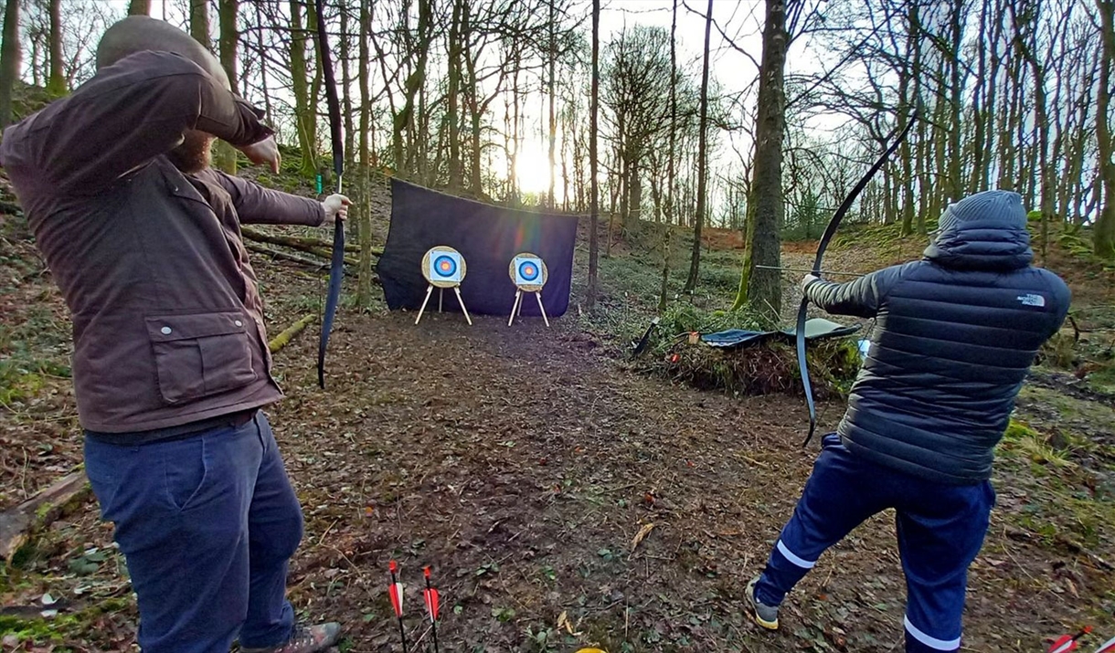 Visitors Shooting at Archery Targets with Green Man Survival in Newby Bridge, Lake District