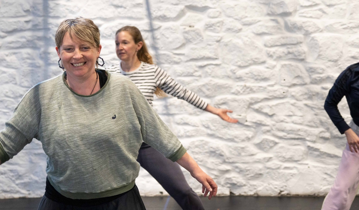 a group of ladies dancing in a studio