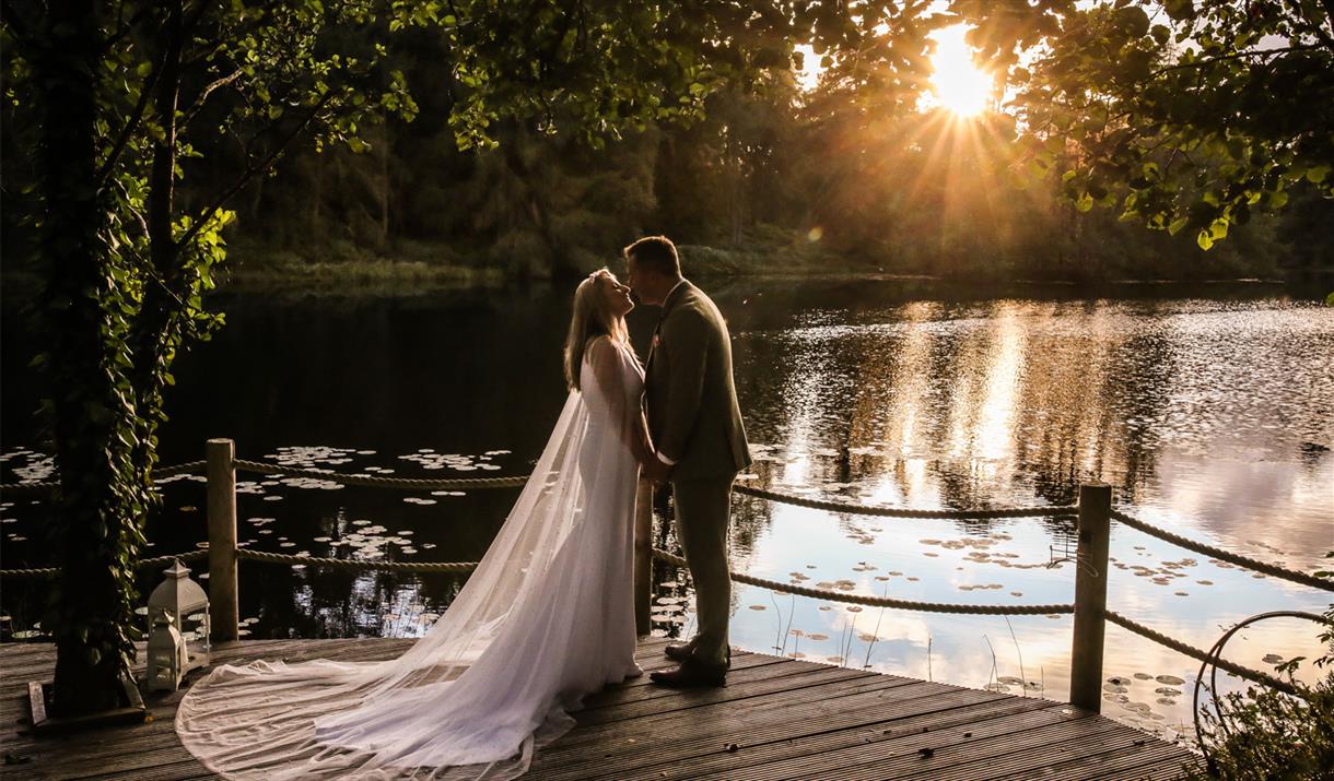 Bridal Couple Posing at Sunset at a Wedding at The Gilpin Hotel & Lake House in Windermere, Lake District