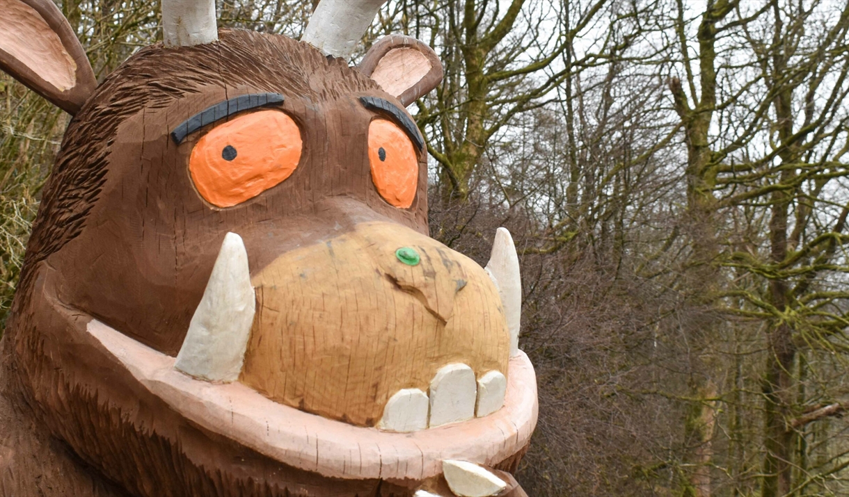 photo of the Gruffalo with a forest in the background