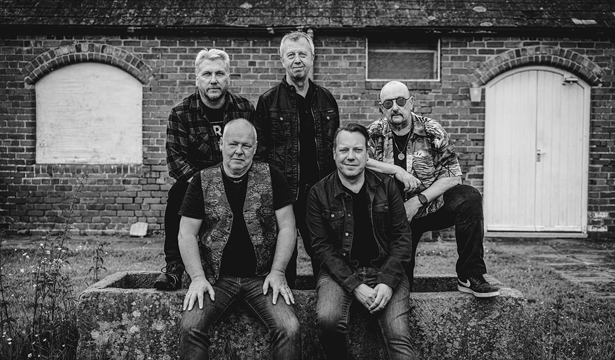 Black and white photo of the band "Guitar Heads"