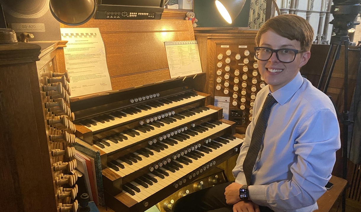 Picture of Harry Brown sitting by a organ
