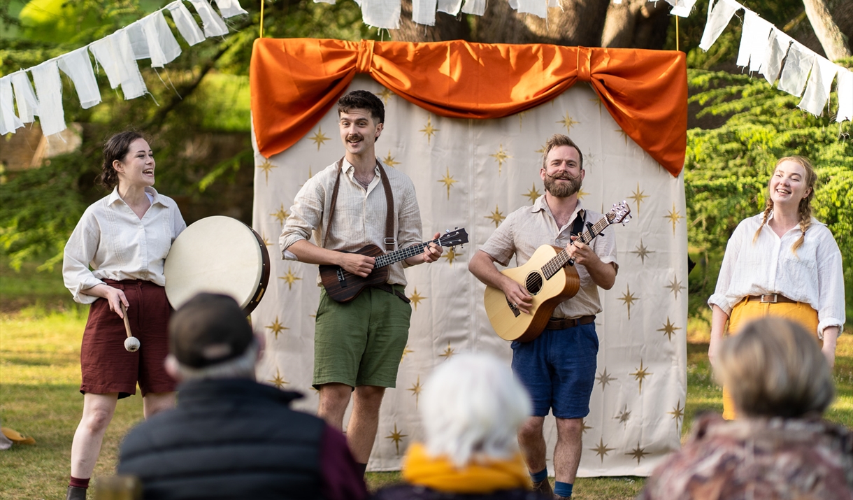 Actors the Handlebards performing in costume