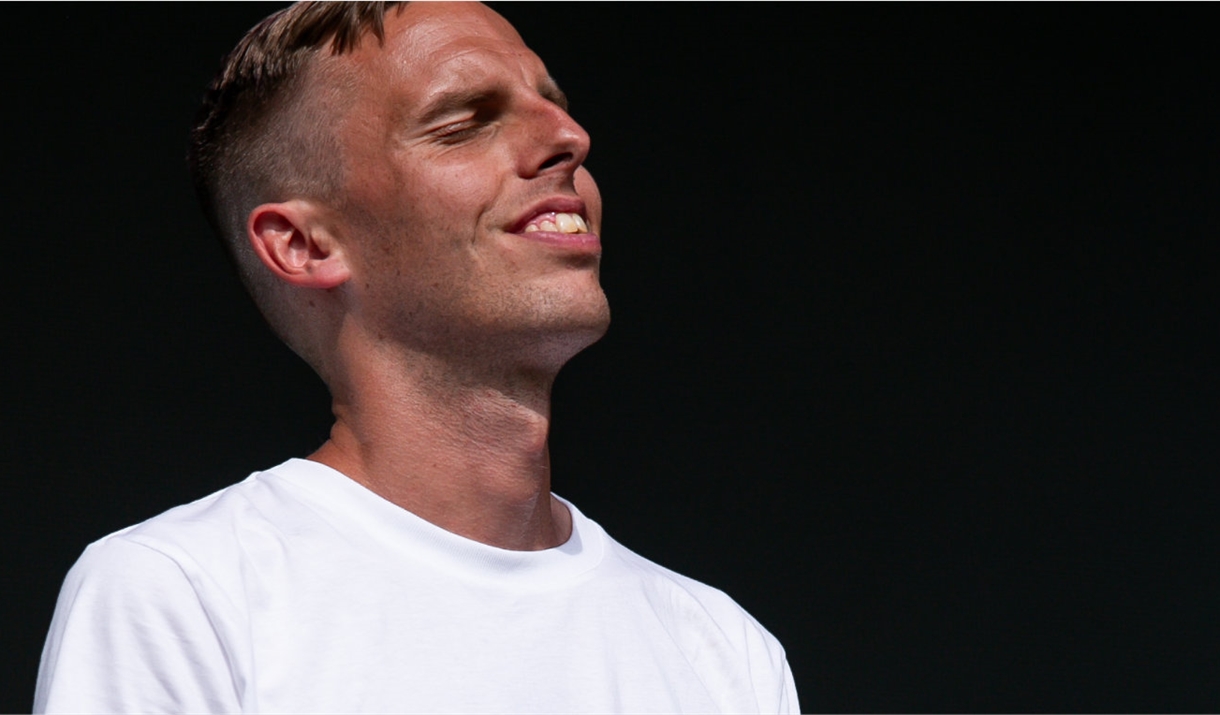 Poet Harry Baker with his eyes closed