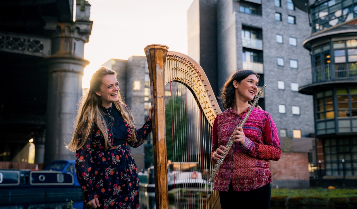Hathor Duo stood in the city, holding their instruments