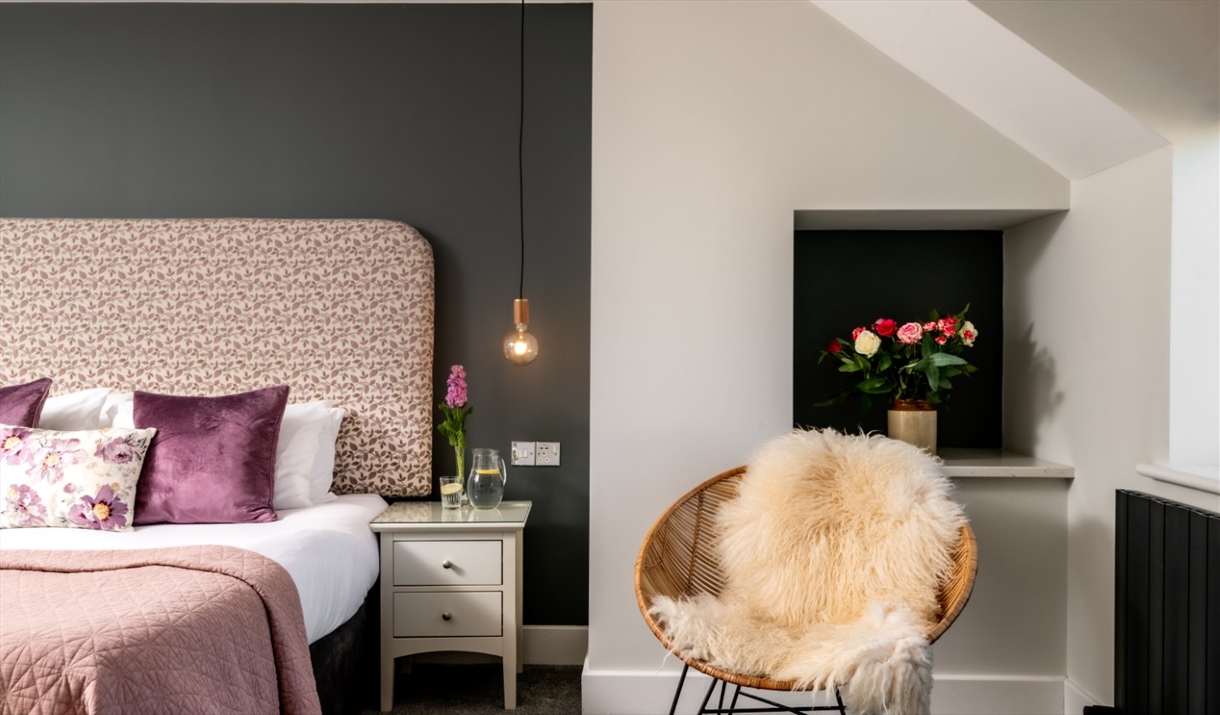 Double bedroom and decor in Hoglet Cottage at Dandelion & Hoglet Cottages, near Dalston, Cumbria