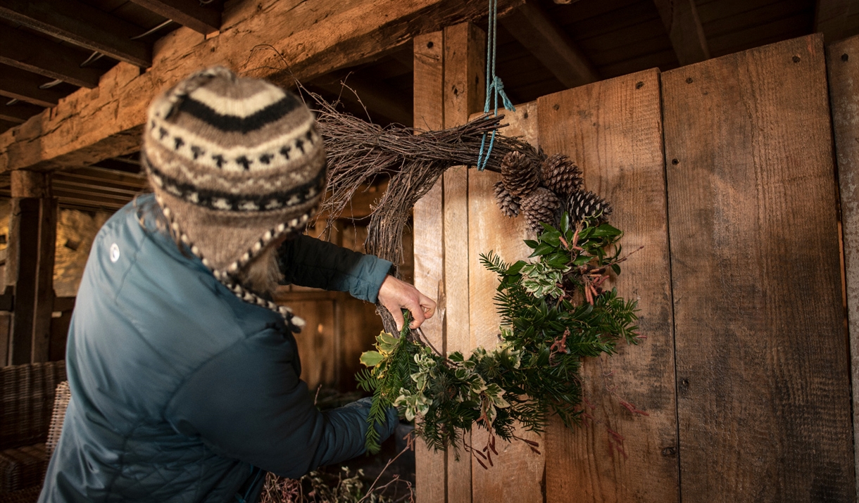 Person making a wreath
