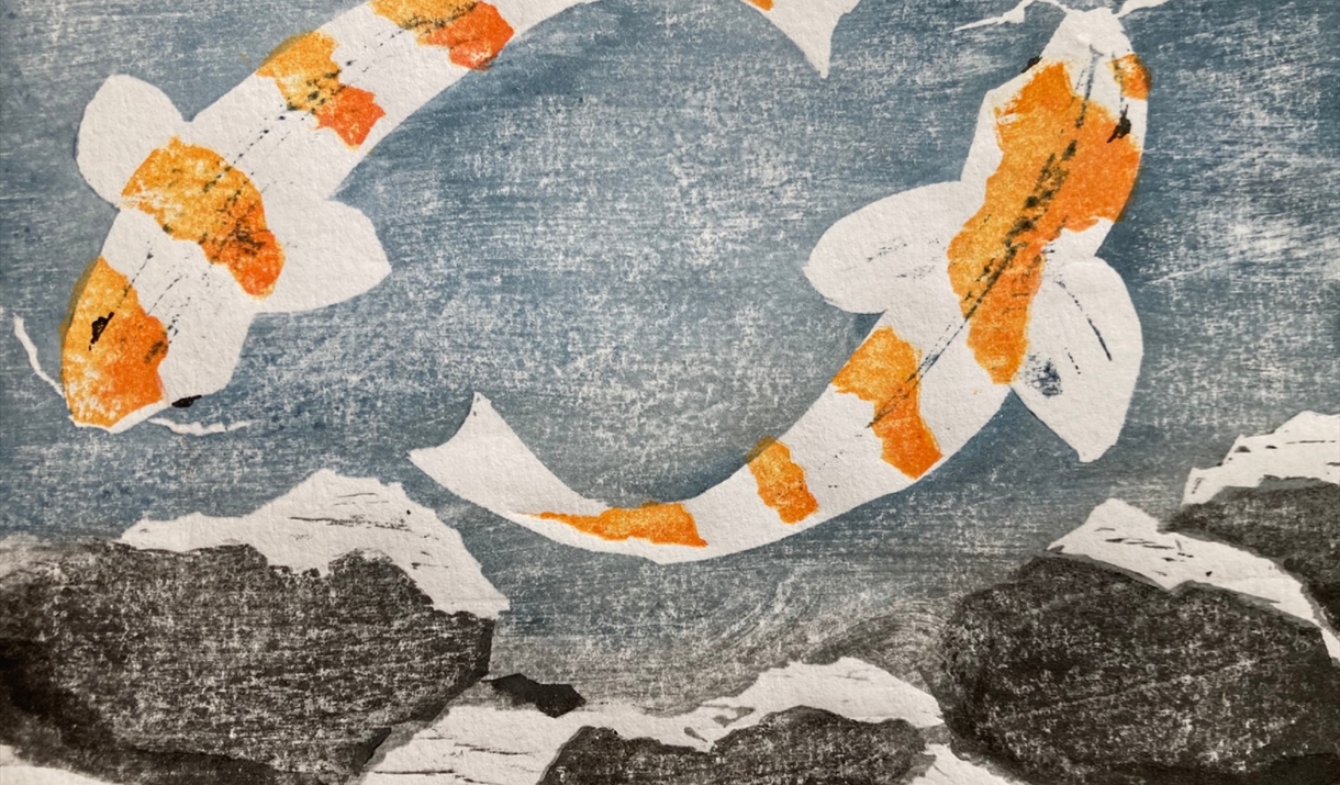 Woodblock  print of two koi fish swimming in a pond