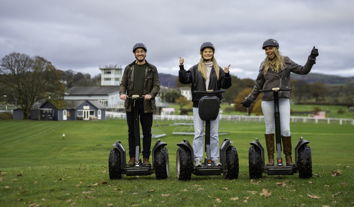 Visitors enjoying an experience with Lakeland Segway in Cartmel, Lake District